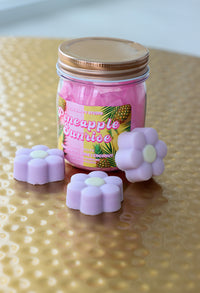 jar of purple daisy-shaped wax melts
