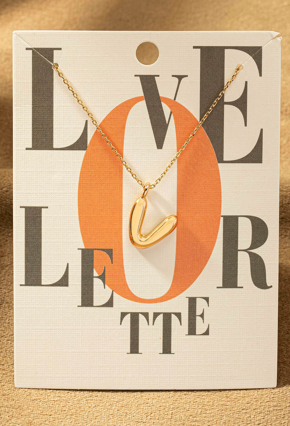 V letter gold necklace