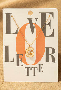 G letter gold necklace