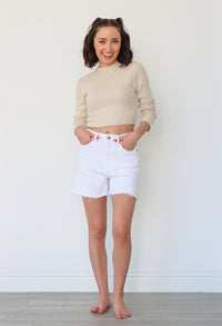 girl wearing white denim shorts