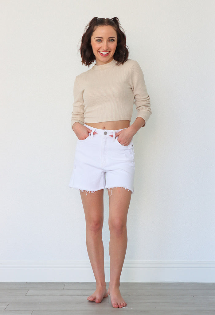 girl wearing white denim shorts